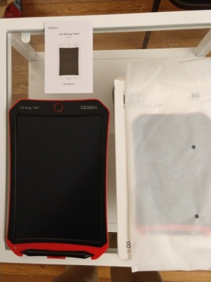 Unboxing the tablet reveals the tablet itself, the protective envelope it was packed in, and the instruction pamphlet.